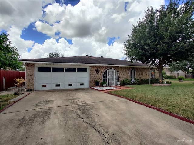 ranch-style house with a garage and a front lawn