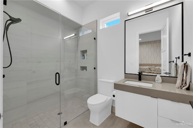 ensuite bathroom featuring vanity, ensuite bath, toilet, and a shower stall