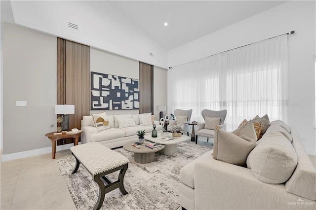 living area featuring high vaulted ceiling, recessed lighting, visible vents, and baseboards