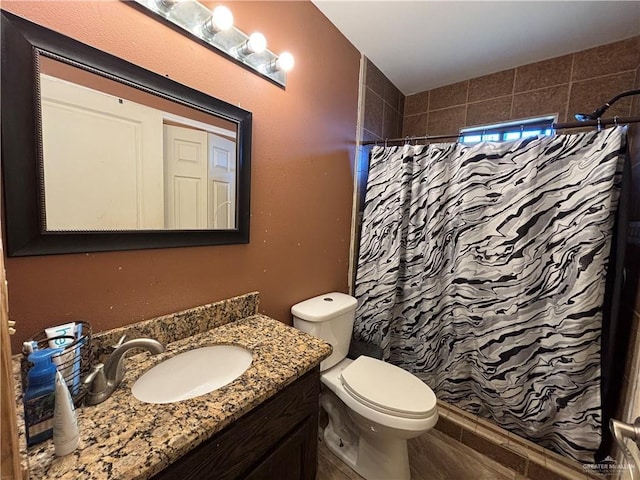 16400 Mcalister Ave, Edinburg, TX 78541 - full bathroom with vanity, toilet, and a shower with curtain