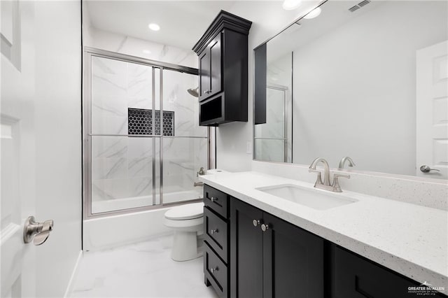 bathroom with vanity, bath / shower combo with glass door, toilet, marble finish floor, and visible vents