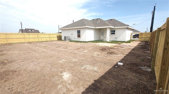 rear view of house with cooling unit