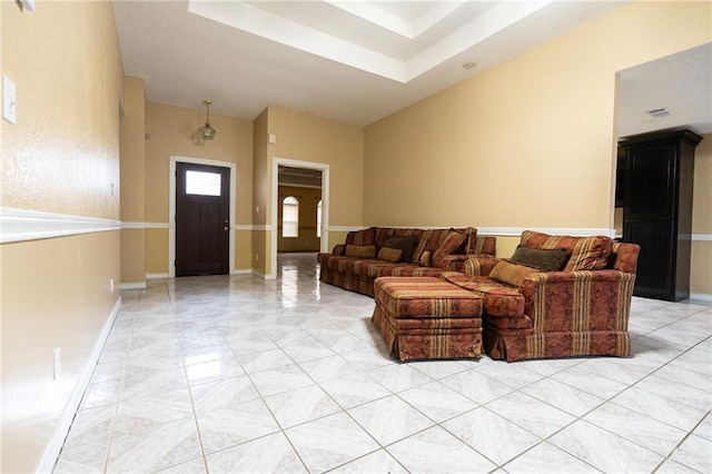 living room featuring a high ceiling