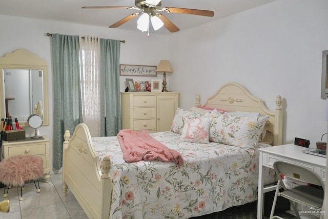 tiled bedroom featuring ceiling fan