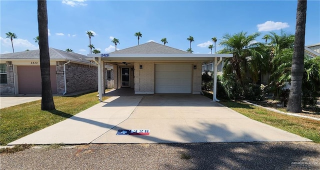 single story home with a garage and a front yard