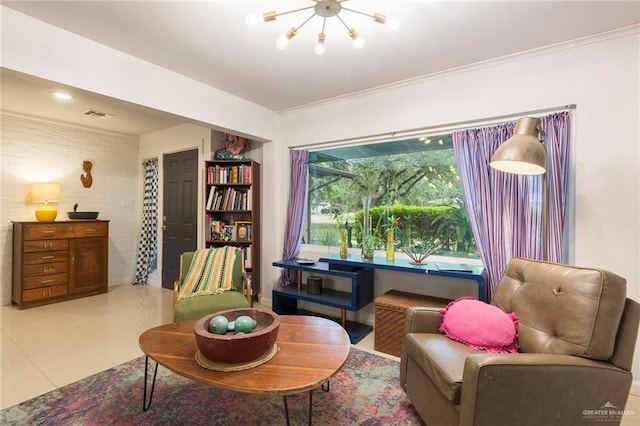 living area with tile patterned floors, crown molding, and a chandelier