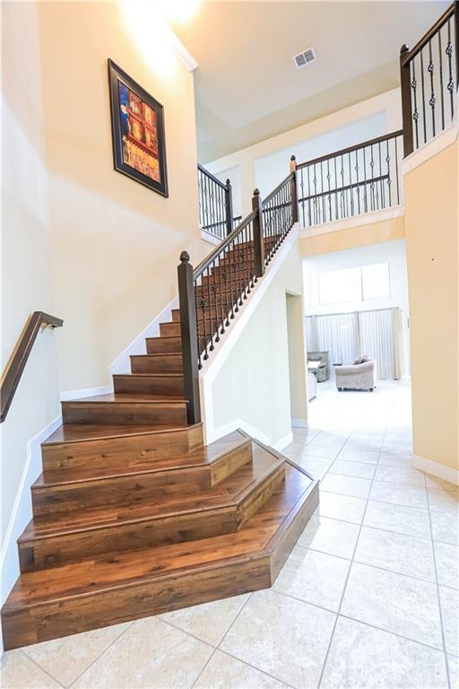 stairway with tile patterned flooring