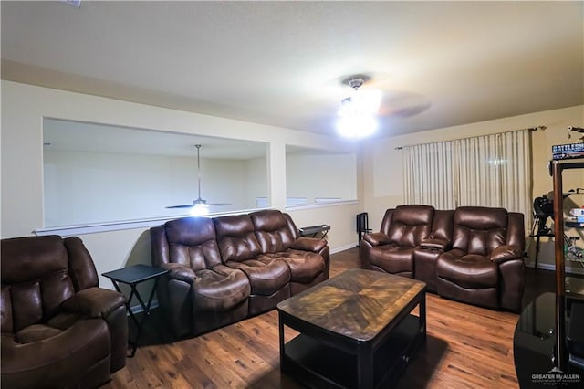 living room with hardwood / wood-style flooring and ceiling fan