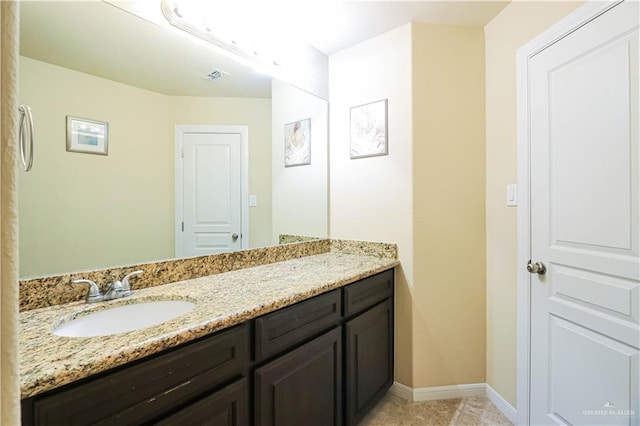 bathroom with tile patterned floors and vanity