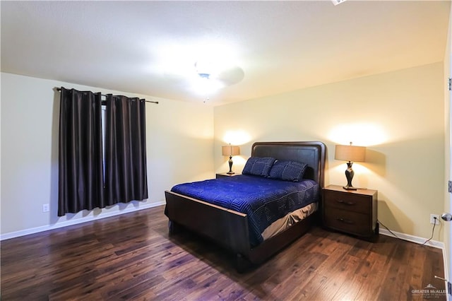 bedroom featuring dark hardwood / wood-style flooring