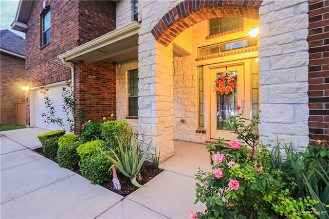 view of exterior entry featuring a garage