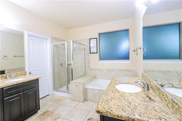 bathroom with separate shower and tub, tile patterned flooring, and vanity