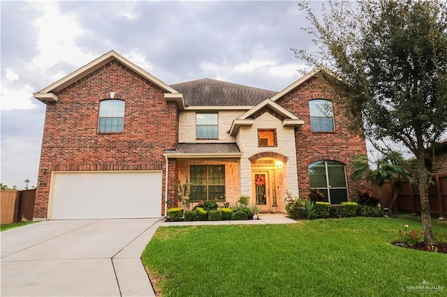 view of property with a garage and a front yard