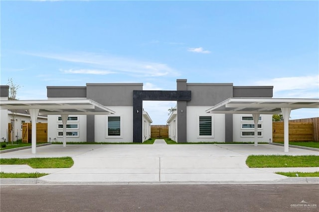 contemporary home featuring a carport