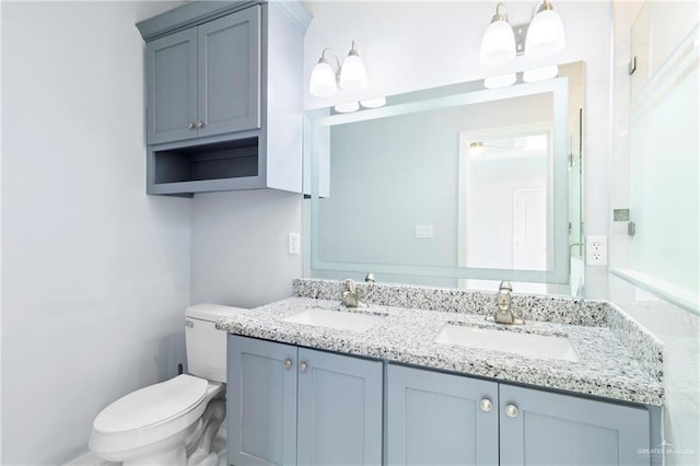 bathroom with ceiling fan, vanity, and toilet