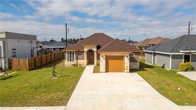 view of front facade with a front yard and a garage