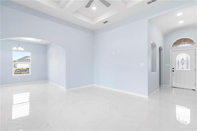 interior space with beamed ceiling, ceiling fan with notable chandelier, and coffered ceiling