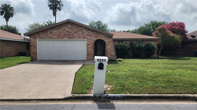 6200 N 31st St, Mcallen, TX 78504 - ranch-style home with brick siding, a front yard, concrete driveway, an attached garage, and central air condition unit