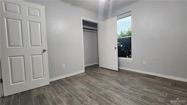 6200 N 31st St, Mcallen, TX 78504 - unfurnished bedroom featuring wood finished floors, baseboards, and a closet