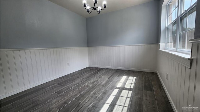 6200 N 31st St, Mcallen, TX 78504 - spare room featuring a chandelier, dark wood-style flooring, wainscoting, and baseboards