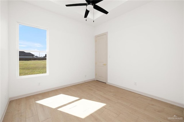 spare room featuring ceiling fan and light hardwood / wood-style flooring