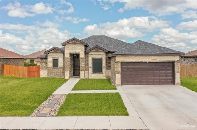 view of front facade featuring a garage and a front lawn