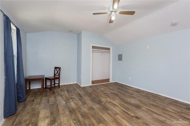 bedroom featuring ceiling fan, a closet, dark wood-type flooring, and vaulted ceiling