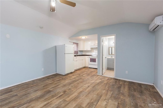 kitchen with lofted ceiling, white cabinetry, light wood-type flooring, and white appliances