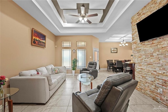 2504 April Ave, Edinburg, TX 78541 - living area with a tray ceiling, ceiling fan, and a chandelier