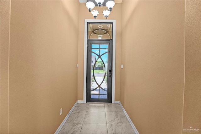 2504 April Ave, Edinburg, TX 78541 - entryway with a chandelier and light marble finish floors