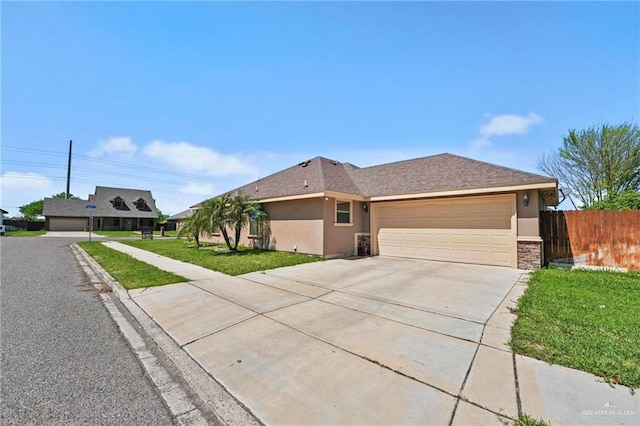 2504 April Ave, Edinburg, TX 78541 - ranch-style house with driveway, stucco siding, and an attached garage