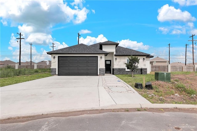 view of front of home with a garage and a front lawn