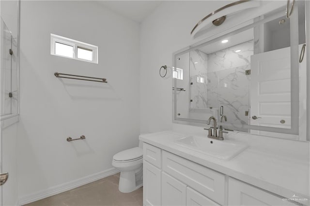 bathroom featuring vanity, a shower with shower door, and toilet