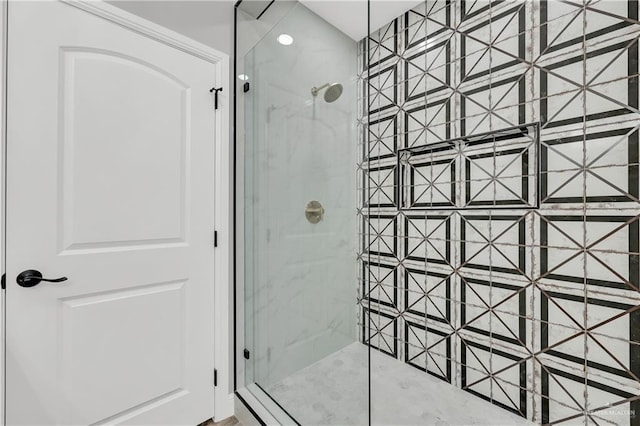 bathroom with a tile shower