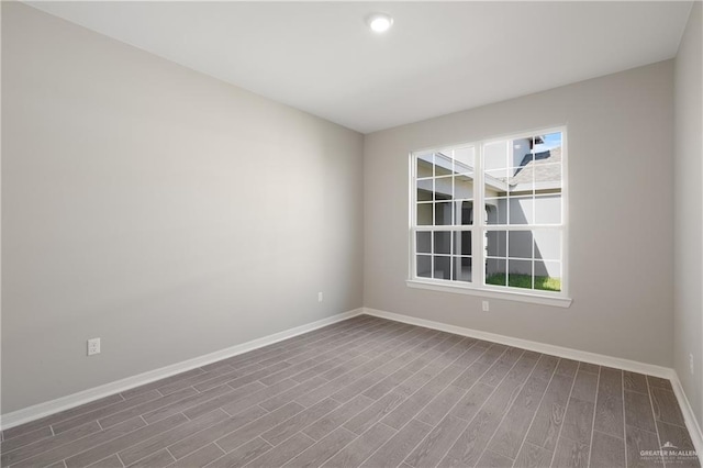 unfurnished room featuring wood-type flooring