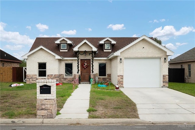 view of front of property featuring a garage and a front lawn