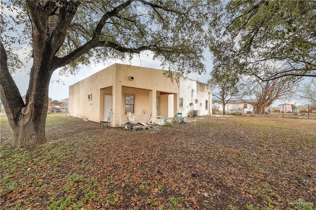 back of house with stucco siding