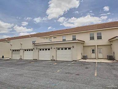 1413 E Keeton Ave Unit 19, Mcallen, TX 78503 - view of front facade with central AC and stucco siding