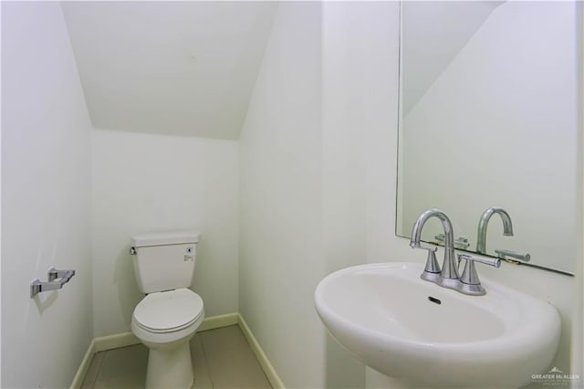 1413 E Keeton Ave Unit 19, Mcallen, TX 78503 - half bath featuring tile patterned flooring, baseboards, a sink, and toilet