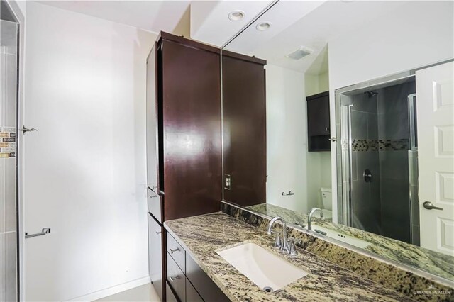 1413 E Keeton Ave Unit 19, Mcallen, TX 78503 - full bath featuring a stall shower, vanity, and toilet
