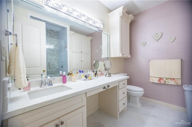 full bathroom with toilet, a stall shower, baseboards, marble finish floor, and vanity