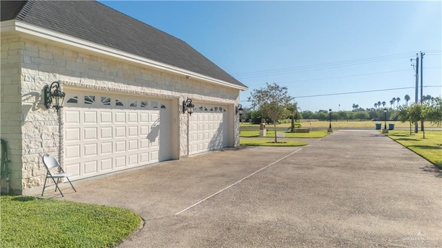 garage with concrete driveway