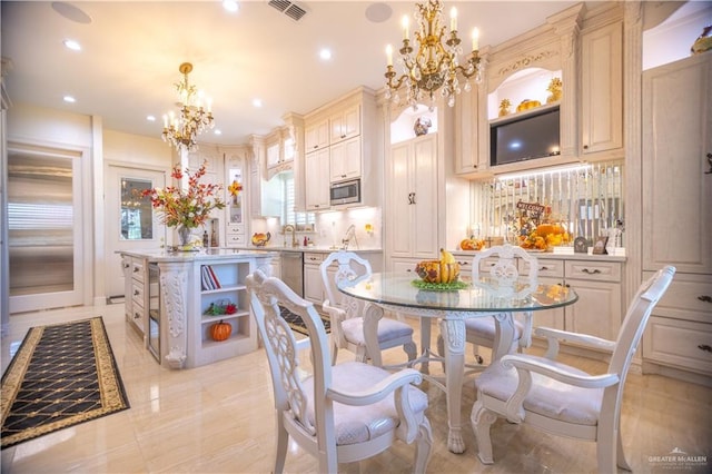 dining space with a notable chandelier, visible vents, and recessed lighting