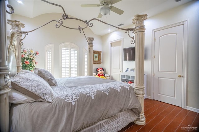 bedroom with ceiling fan, visible vents, and wood finished floors