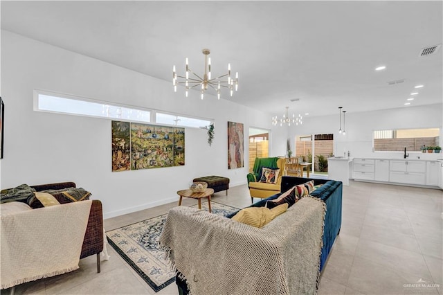living area with an inviting chandelier, baseboards, recessed lighting, and visible vents