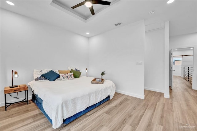 bedroom featuring recessed lighting, baseboards, and light wood-type flooring
