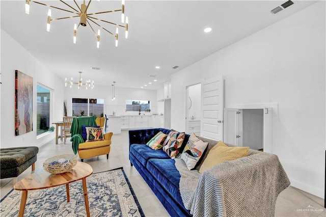 living room with recessed lighting, a chandelier, and visible vents