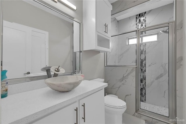 2000 Providence Ave, Mcallen, TX 78504 - full bathroom with vanity, toilet, a marble finish shower, and marble look tiles