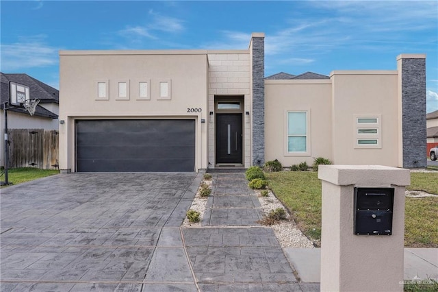 2000 Providence Ave, Mcallen, TX 78504 - view of front of property with stucco siding, decorative driveway, and an attached garage