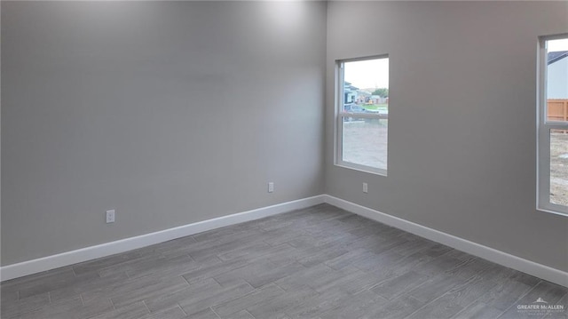 empty room with hardwood / wood-style flooring